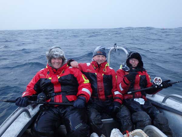 three very happy friends fishing Norway Fishing Report