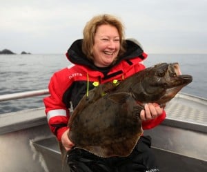 She is so happy with this halibut Norway fishing report