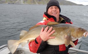 One happy angler with his prize of a big Cod Norway fishing report