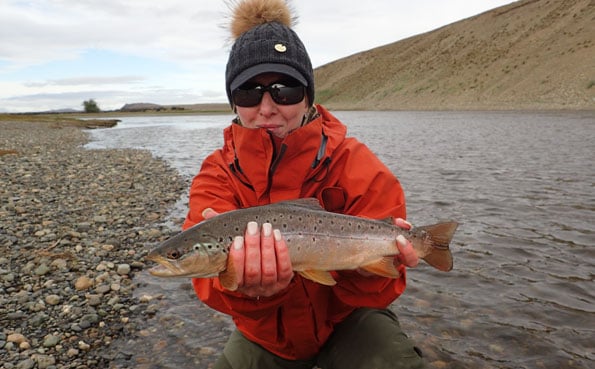 tracey with a small brown trout in argentina