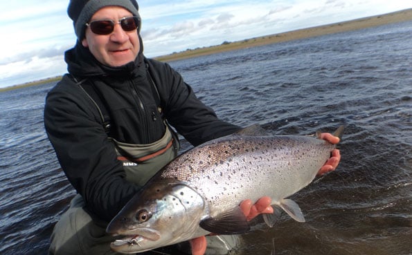 kevin holding a stunning argentine sea trout
