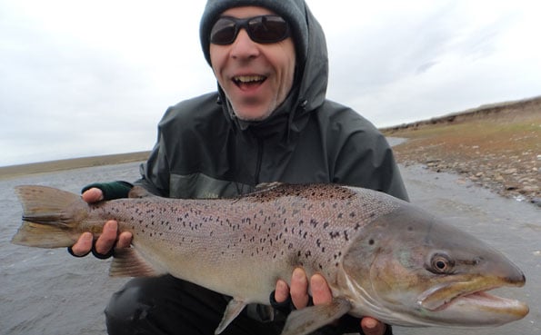 customer holding a nice sea trout caught on sportquest holidays hosted sea trout fly fishing weeks