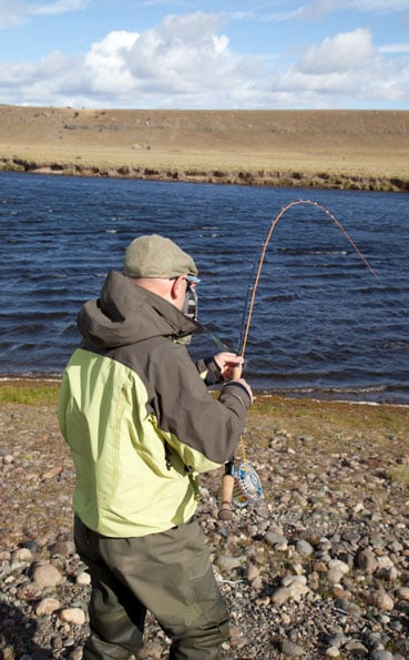 playing a sea trout on a fly rod in Argentina