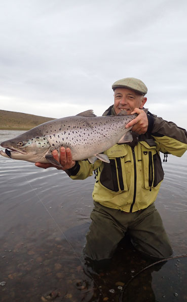 peter collingsworth with a fat hen sea trout in argentina