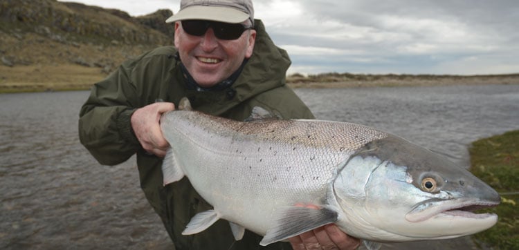 Tony Quine with a cracking Sea Trout caught on a hosted trip by sportquest holidays