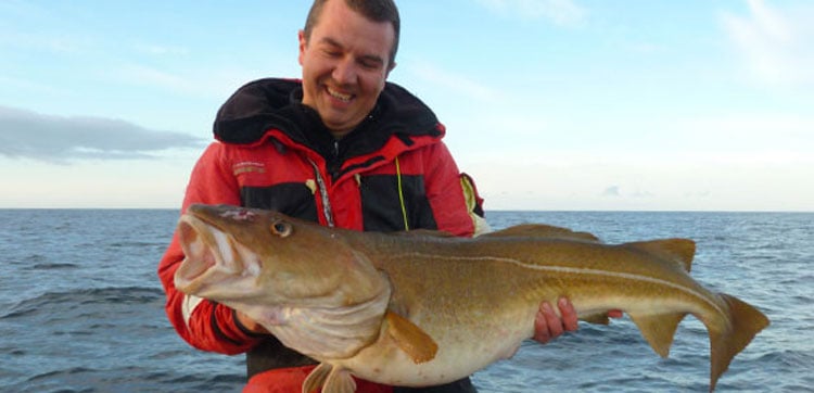 A man with a big fishing report norway