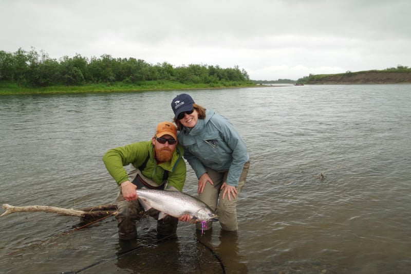 lady anglers enjoying our salmon fishing with her fresh King Salmon from alaska