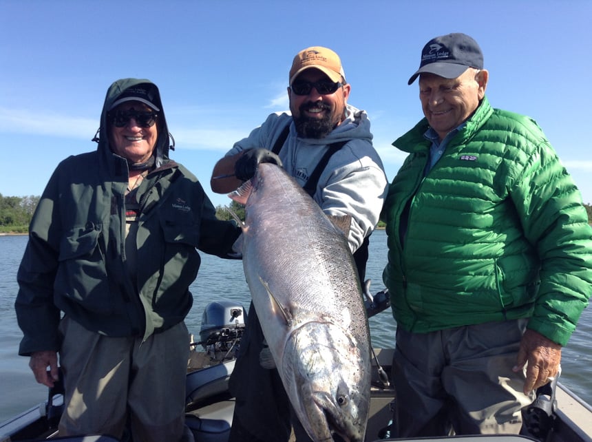 customers and guide look very happy holding up this king salmon from alaska