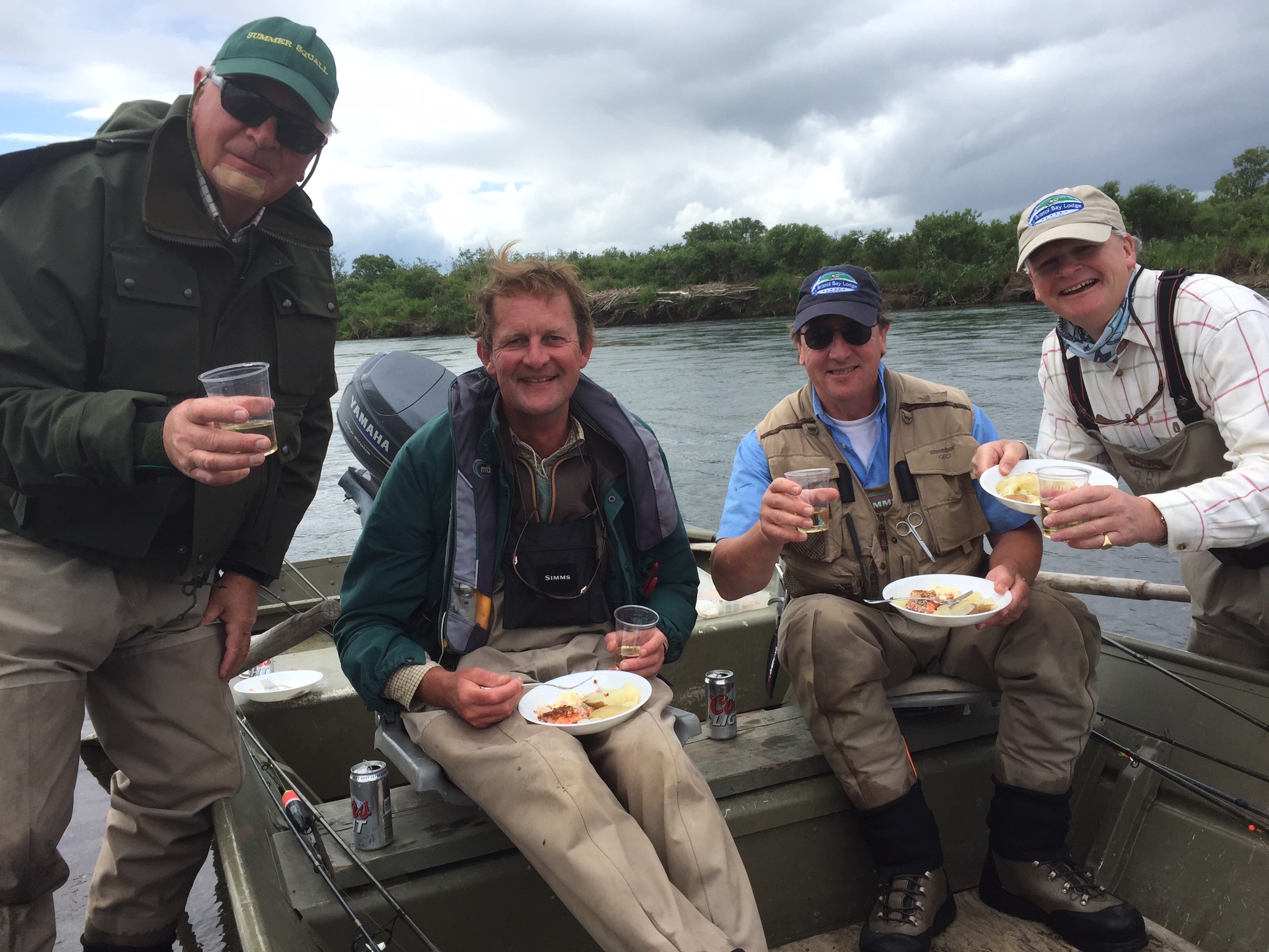 Anglers eating a shore lunch, fly fishing Alaska