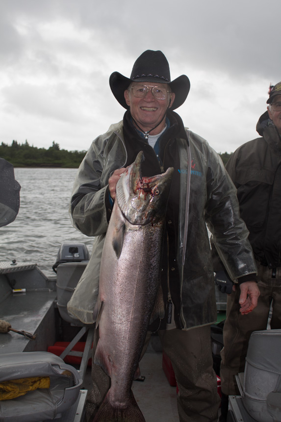 customer holding up a king salmon caught in alaska Mission Lodge Fishing Report