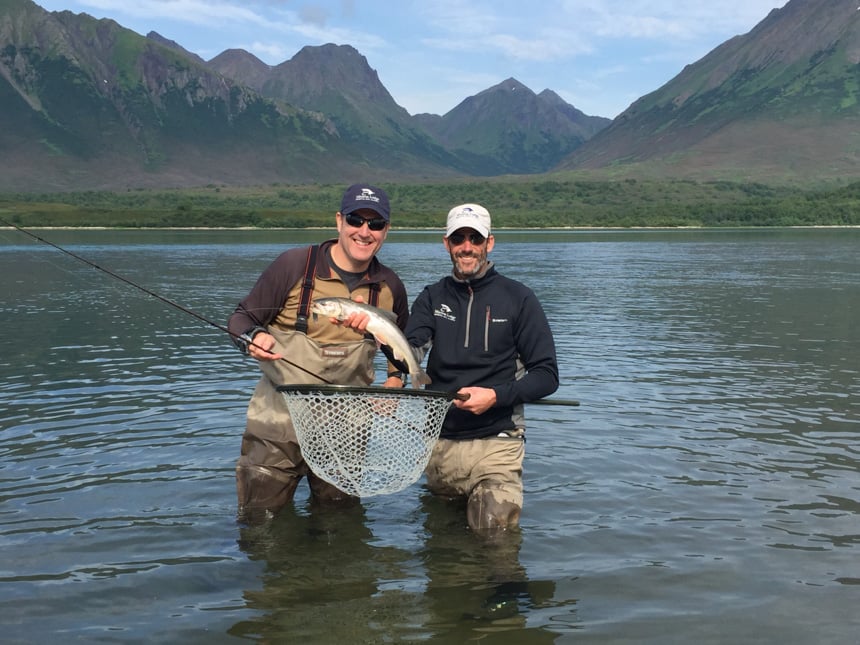 customer and guide with a dolly varden fly fishing in alaska