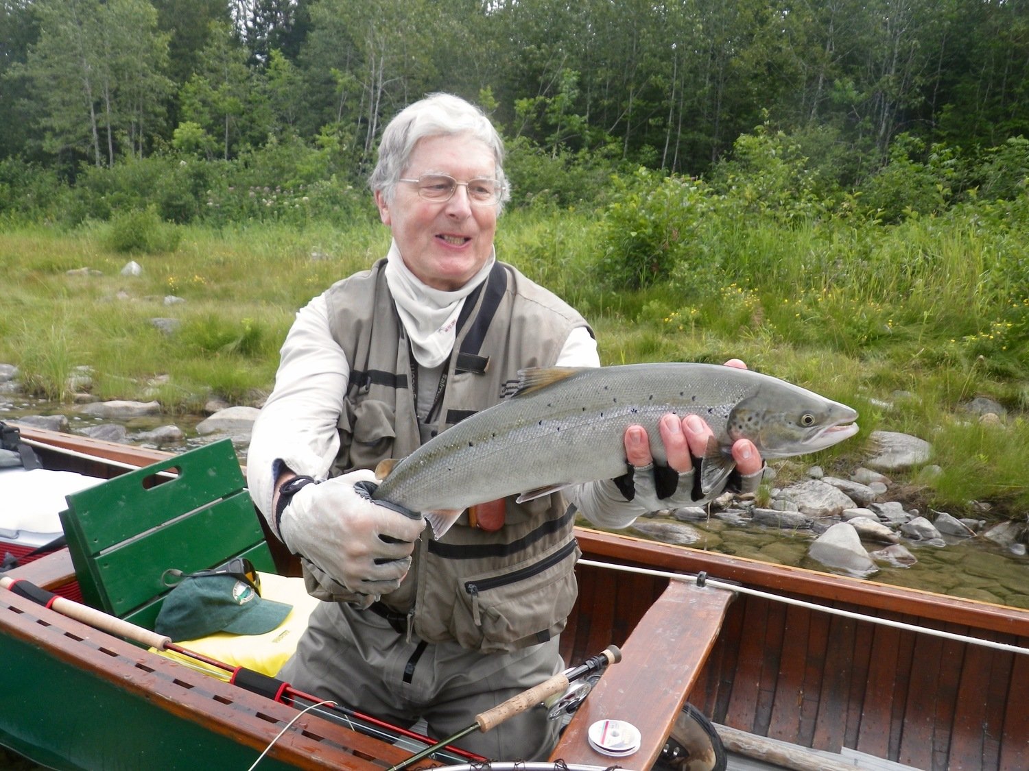 Another happy customer holding up a fresh Atlantic Salmon