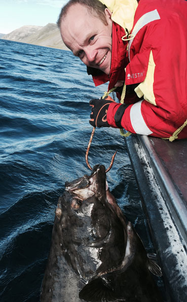 Jet black Halibut caught on our Norway Fishing Report