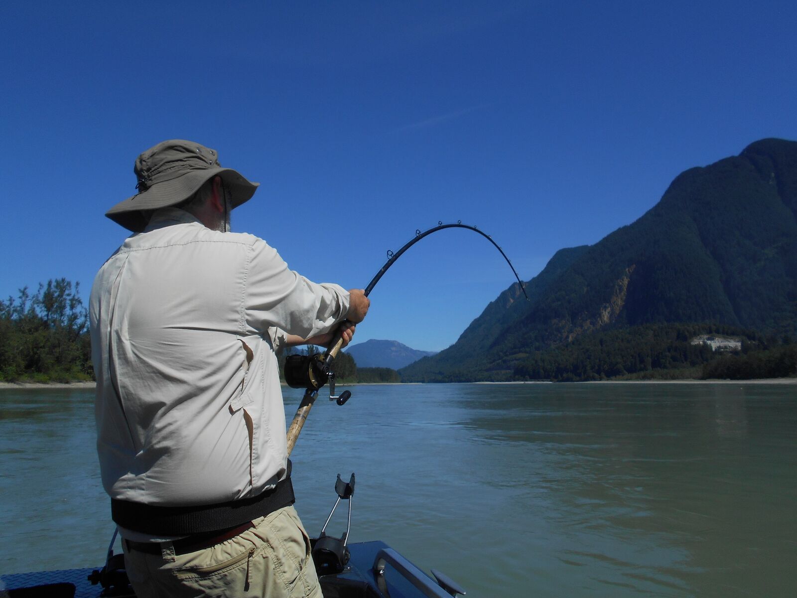 A man holding on to his fishing rod Fishing Report Canada