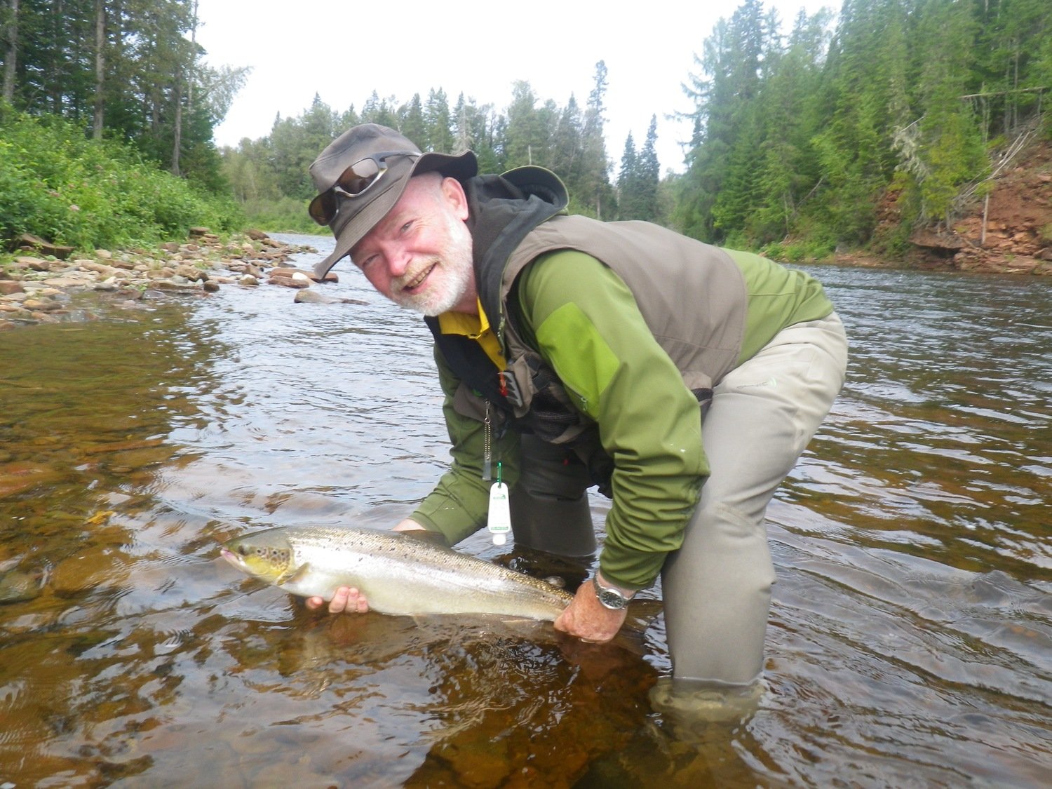 Thats one happy customer with his Atlantic Salmon from our Salmon Lodge Fishing Report