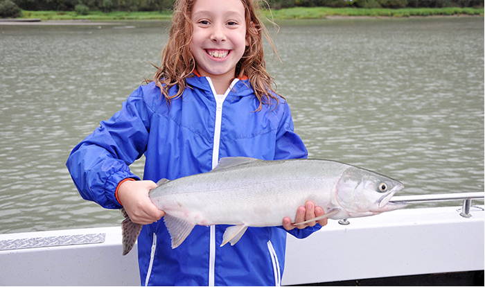 Girl with Salmon in Canada Fishing Report