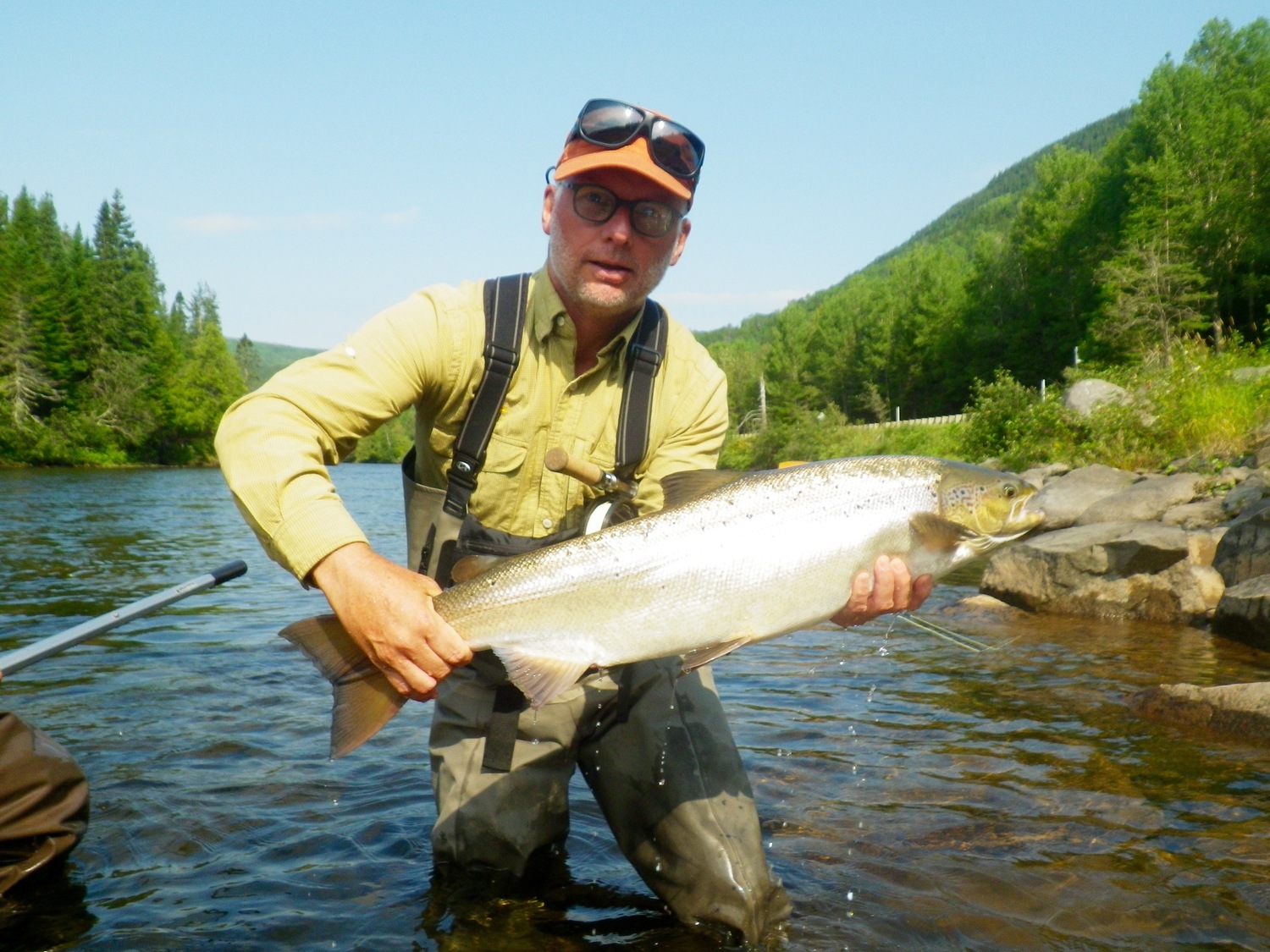 Customer holds up his Atlantic Salmon prize, this one did not jump off