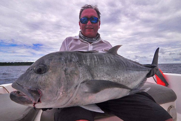 Chris with his biggest GT caught from Andaman Fishing Report