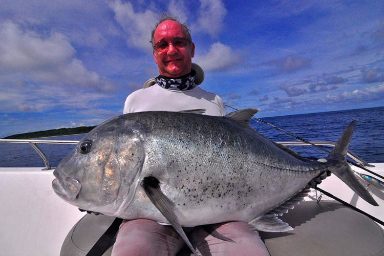 Posing with his huge GT Andaman Fishing Report