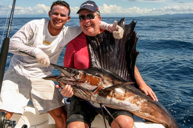 happy angler with huge sailfish