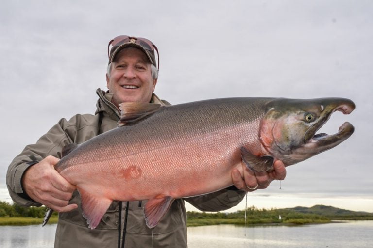 Customer with a redish cock coho salmon