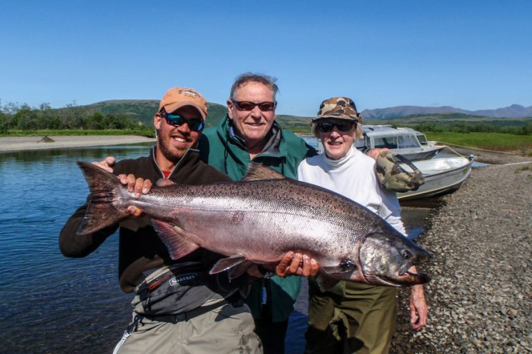 Guide and customers group picture with a king salmon from the lkodge