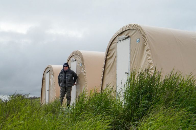 A lone angler leaving his tent