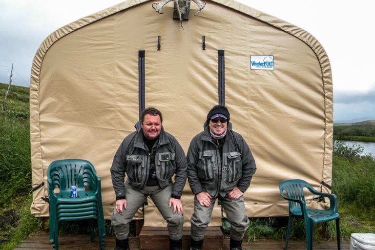 Two anglers at their tents