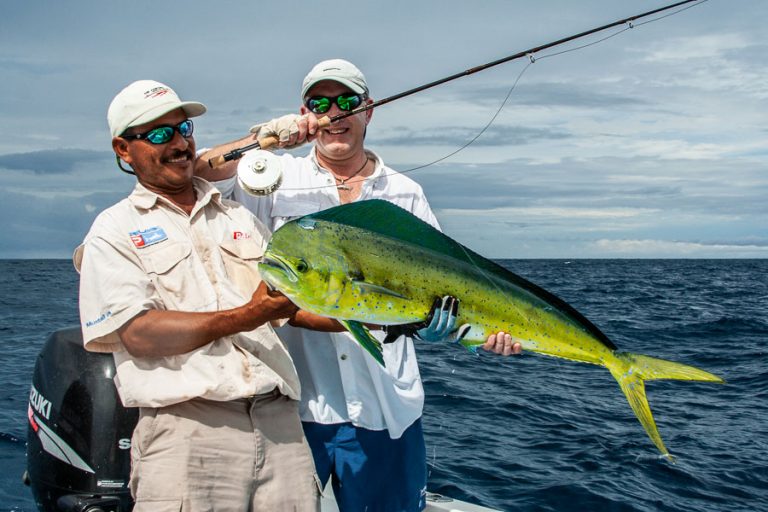 happy fisherman with his dorado