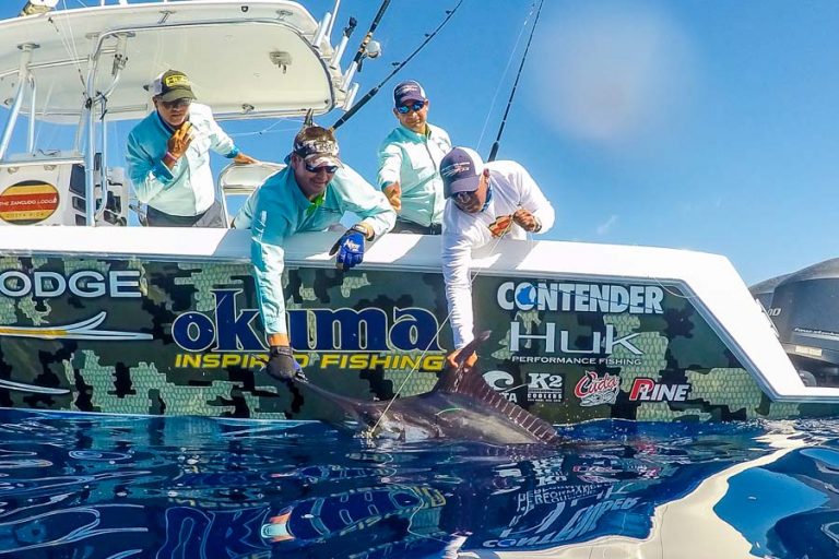 Zancudo Lodge staff helping angler land huge fish