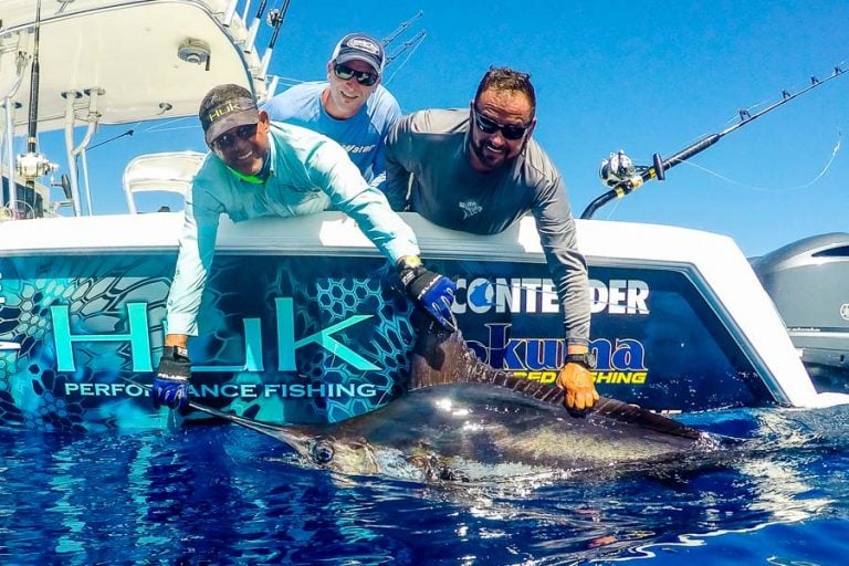 anglers looking pleased with marlin