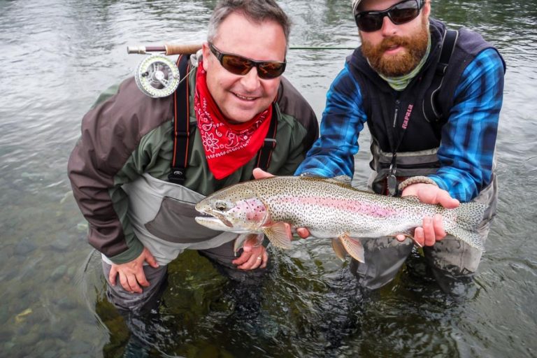 Customer and guide holding carefully a nice Rainbow