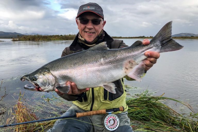 peter collingsworth holding up another nice Coho salmon