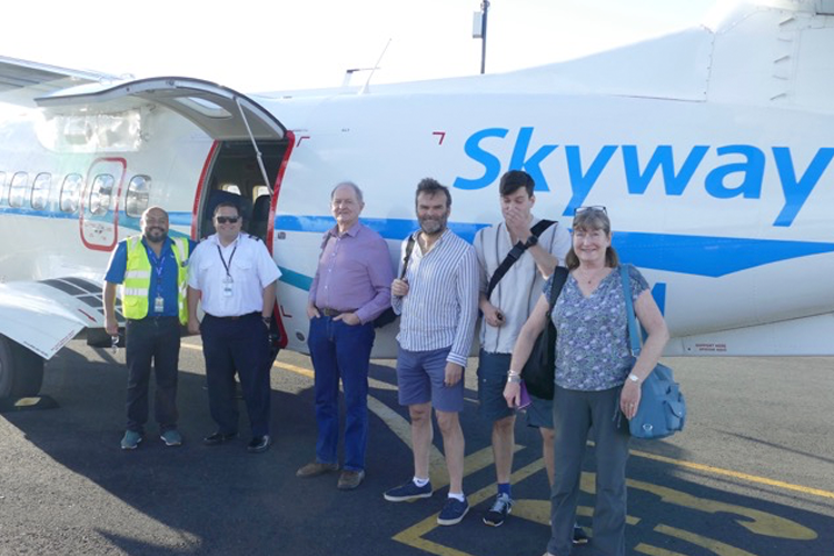 Customers next to plane