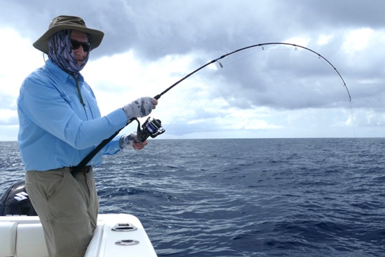 Angler bent into a fish