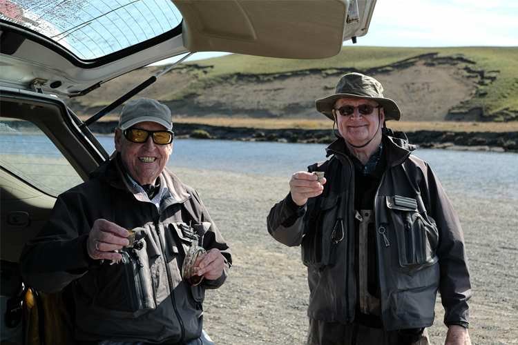 Two anglers preparing for fishing