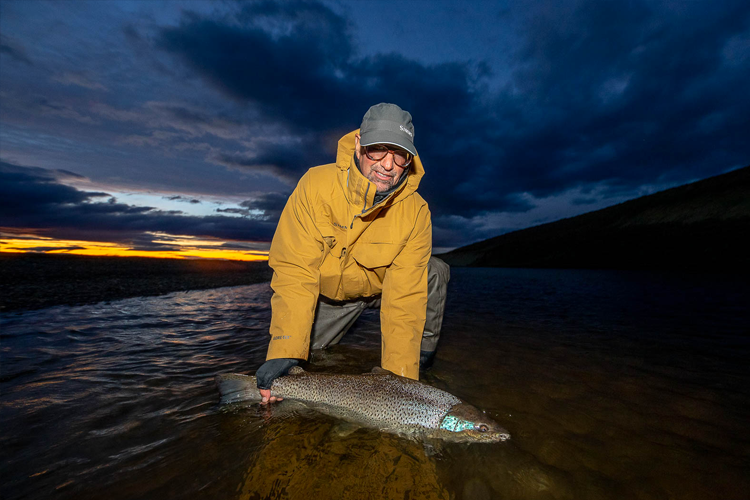 Landing a Sea Trout before Dusk