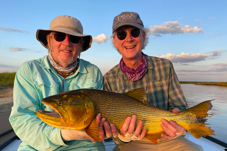 Two anglers with a Golden dorado