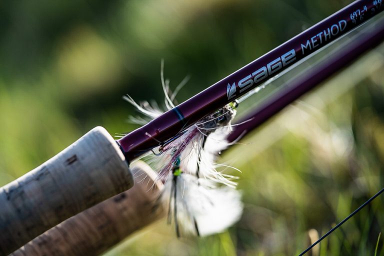 close up picture of a salmon fly hooked up on the rod