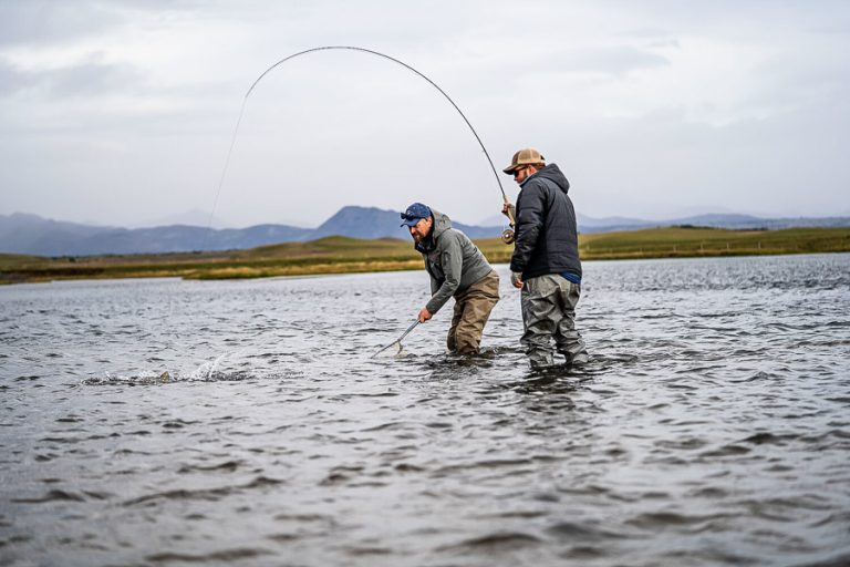 West ranga guide landing a nice atlantic salmon for our customer