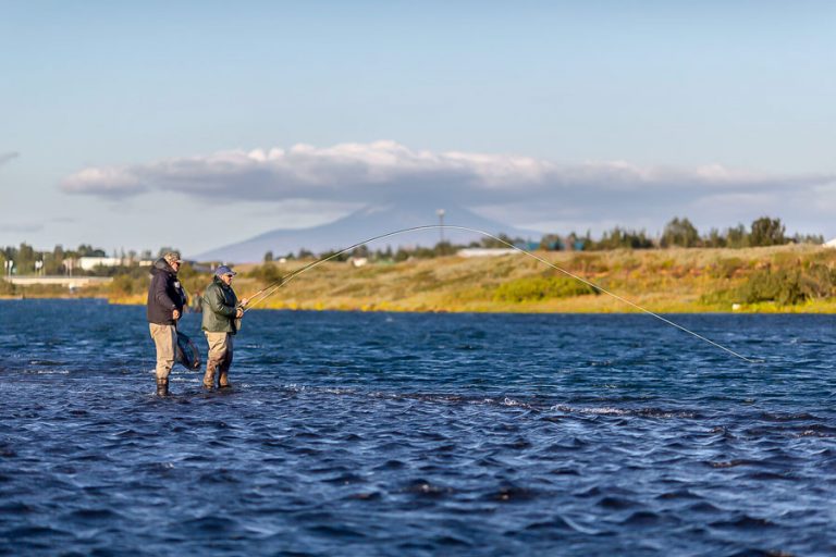 customer and guide wadding the west ranga river atlantic salmon fly fishing