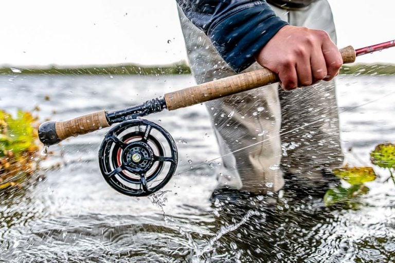 Picture of salmon rod and reel just above the water of the west ranga river