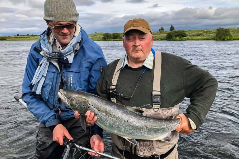 Guide and customer with a huge Atlantic Salmon from the west ranga river iceland