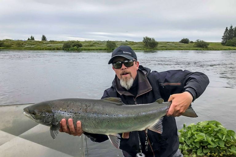 West Ranga Lodge Iceland, angler holding an Atlantic Salmon